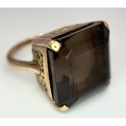 104 - A Vintage 9K Gold Smoky Quartz Ring. Size I. Raised setting. 
13.4g total weight.