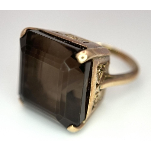 104 - A Vintage 9K Gold Smoky Quartz Ring. Size I. Raised setting. 
13.4g total weight.