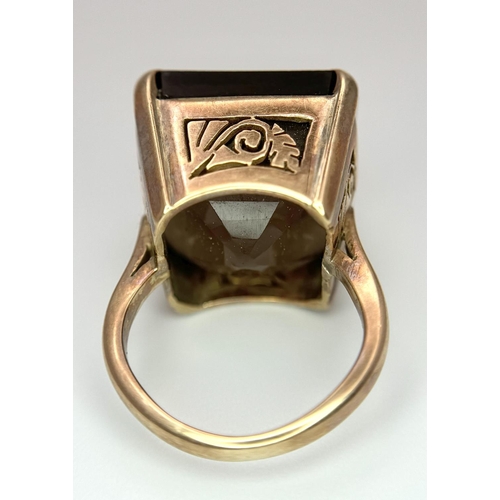 104 - A Vintage 9K Gold Smoky Quartz Ring. Size I. Raised setting. 
13.4g total weight.