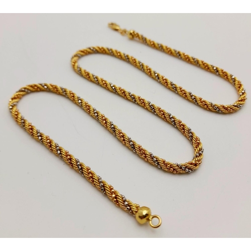 111 - An 18K Yellow and White Gold Rope-Twist Design Necklace. 
44cm. 13.3g weight.