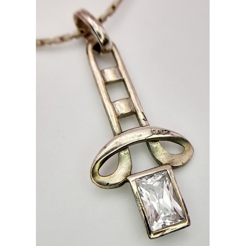 1440 - 2X fancy 925 silver CZ pendant on silver chains. Total weight 7.4G. Total length 40cm and 46cm. Plea... 