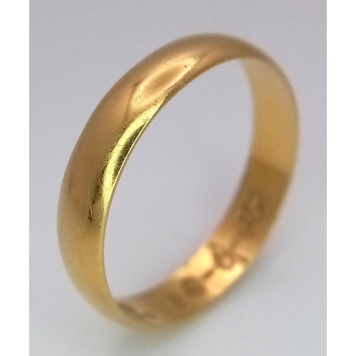 213 - An 18k Yellow Gold Band Ring. 4mm width. Size L 1/2. 1.9g weight.