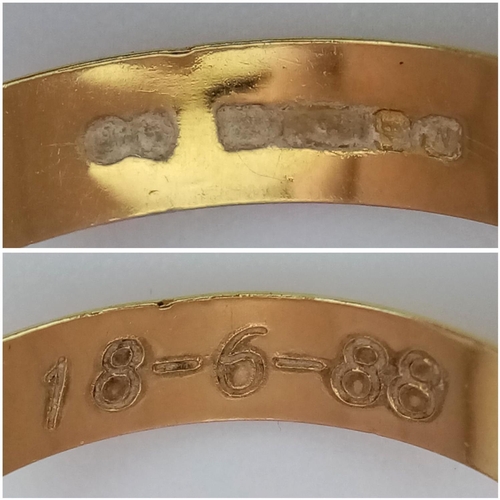 213 - An 18k Yellow Gold Band Ring. 4mm width. Size L 1/2. 1.9g weight.