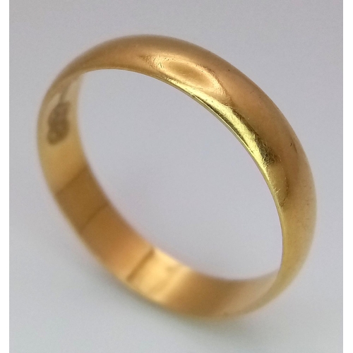 213 - An 18k Yellow Gold Band Ring. 4mm width. Size L 1/2. 1.9g weight.