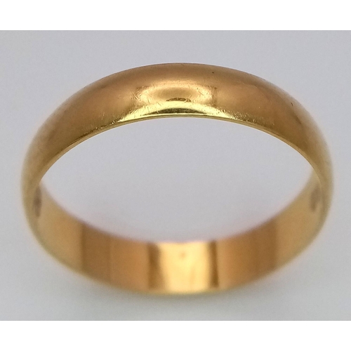 213 - An 18k Yellow Gold Band Ring. 4mm width. Size L 1/2. 1.9g weight.