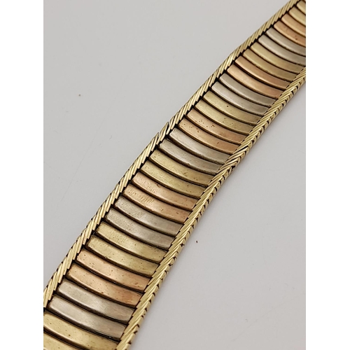 22 - A Vintage 9K Gold Tri-Colour Bracelet. Bands of white, rose ang yellow gold. Clip open design. 18cm.... 