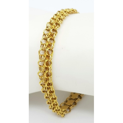 36 - An 18K Yellow Gold Two Row Circle Link Bracelet. 18cm length. 9.8g weight.