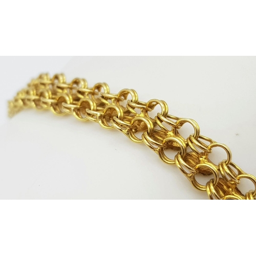 36 - An 18K Yellow Gold Two Row Circle Link Bracelet. 18cm length. 9.8g weight.