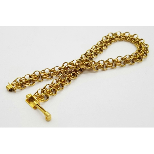 36 - An 18K Yellow Gold Two Row Circle Link Bracelet. 18cm length. 9.8g weight.