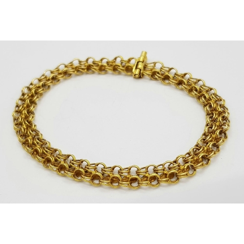 36 - An 18K Yellow Gold Two Row Circle Link Bracelet. 18cm length. 9.8g weight.