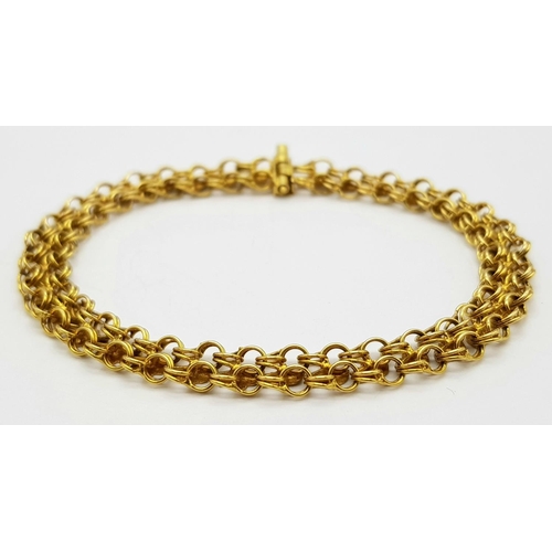 36 - An 18K Yellow Gold Two Row Circle Link Bracelet. 18cm length. 9.8g weight.