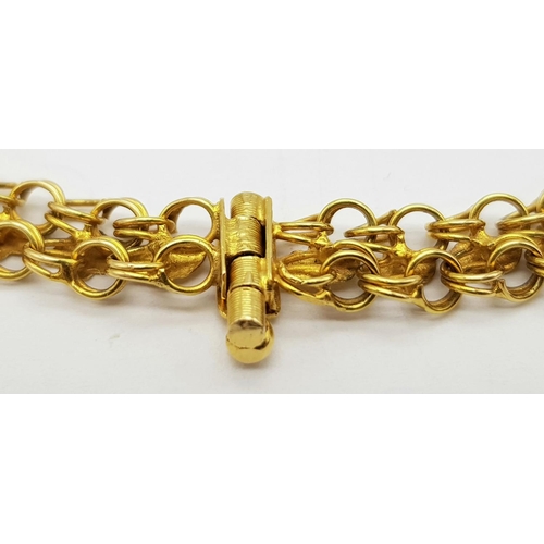 36 - An 18K Yellow Gold Two Row Circle Link Bracelet. 18cm length. 9.8g weight.