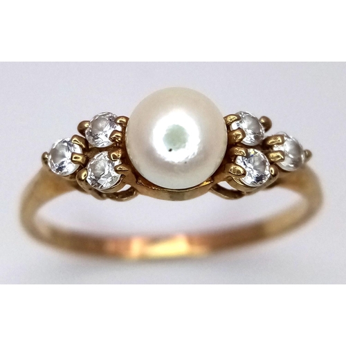 556 - A 9K Yellow Gold Pearl and White Stone Ring. Size K. 1.4g total weight.