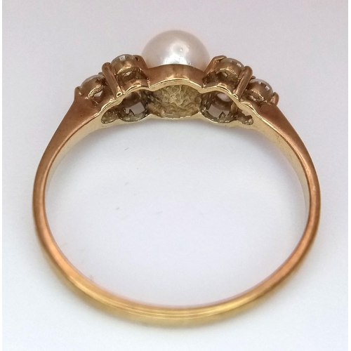 556 - A 9K Yellow Gold Pearl and White Stone Ring. Size K. 1.4g total weight.