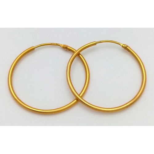 639 - A Pair of Thin 18K Yellow Gold Hoop Earrings. 2g total weight.