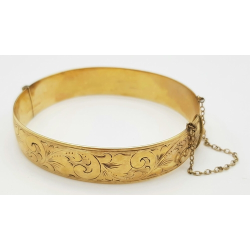 79 - A Vintage 9K Yellow Rolled Gold Bangle. Brass core. 31.7g total weight.