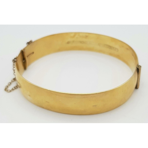 79 - A Vintage 9K Yellow Rolled Gold Bangle. Brass core. 31.7g total weight.