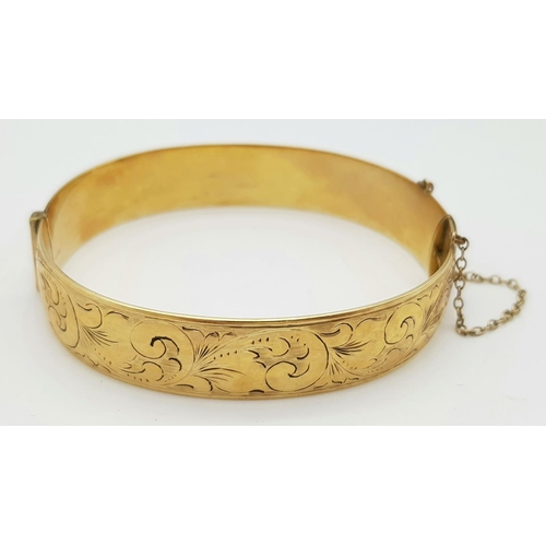 79 - A Vintage 9K Yellow Rolled Gold Bangle. Brass core. 31.7g total weight.