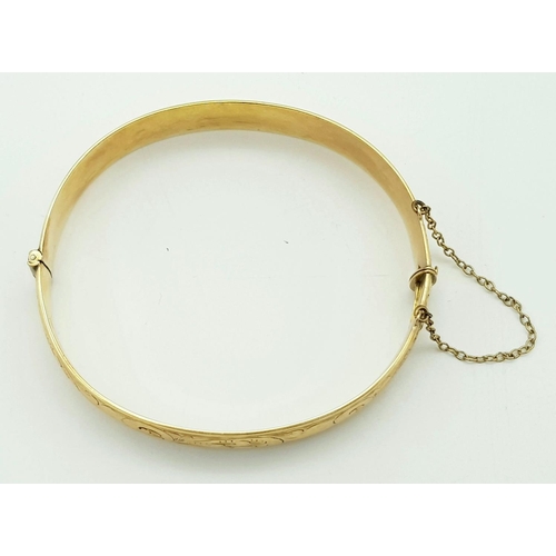 79 - A Vintage 9K Yellow Rolled Gold Bangle. Brass core. 31.7g total weight.