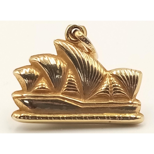 1179 - A 9K Yellow Gold Opera House Pendant. 2cm. 1.6g.