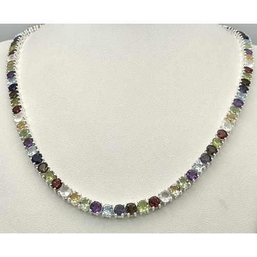 191 - A Multi-Gemstone Necklace. Includes: Amethyst, Garnet, Peridot and Topaz. Set in 925 silver. 44cm. R... 