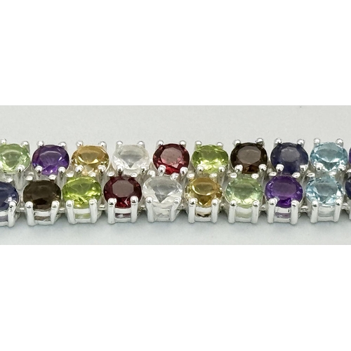 191 - A Multi-Gemstone Necklace. Includes: Amethyst, Garnet, Peridot and Topaz. Set in 925 silver. 44cm. R... 