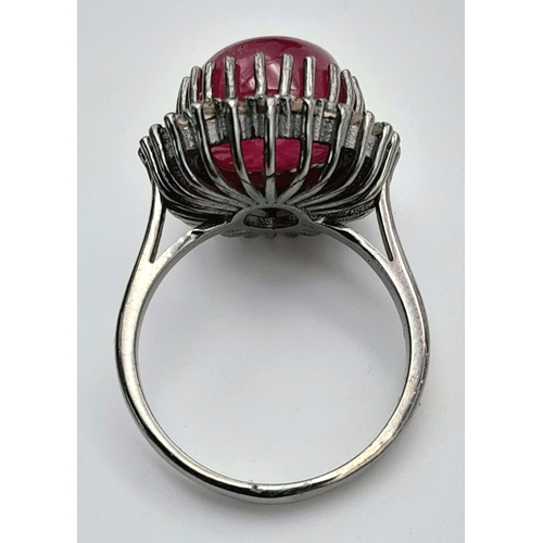 331 - A Ruby Cabochon Gemstone Ring with Diamond Surround. Ruby - 8ct. Diamonds - 0.40ctw. Set in 925 Silv... 