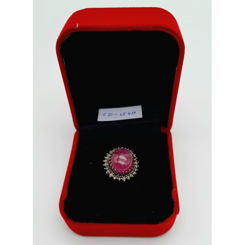 331 - A Ruby Cabochon Gemstone Ring with Diamond Surround. Ruby - 8ct. Diamonds - 0.40ctw. Set in 925 Silv... 