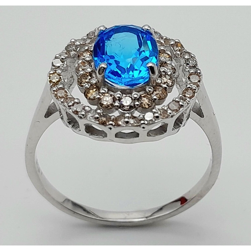 442 - A 1.2ct Blue Topaz Ring with 0.52ctw of Diamond Accents. Set in 925 Silver. Size Q. Ref: CD-1512