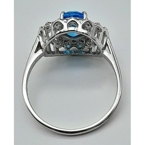 442 - A 1.2ct Blue Topaz Ring with 0.52ctw of Diamond Accents. Set in 925 Silver. Size Q. Ref: CD-1512