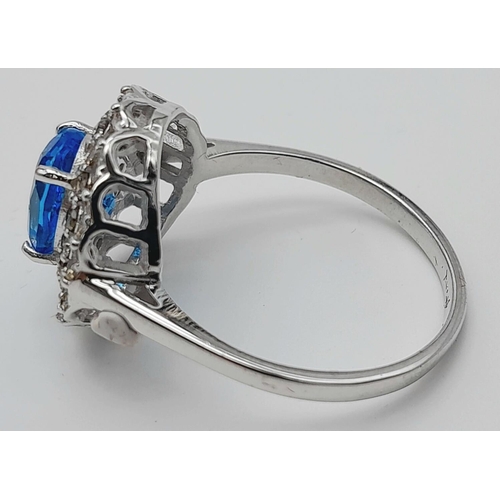 442 - A 1.2ct Blue Topaz Ring with 0.52ctw of Diamond Accents. Set in 925 Silver. Size Q. Ref: CD-1512