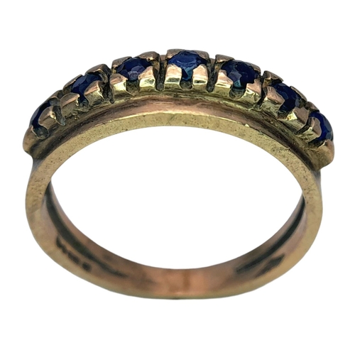 506 - A Vintage 9K Gold Seven Stone Sapphire Ring. Size N 1/2. 3.1g total weight.