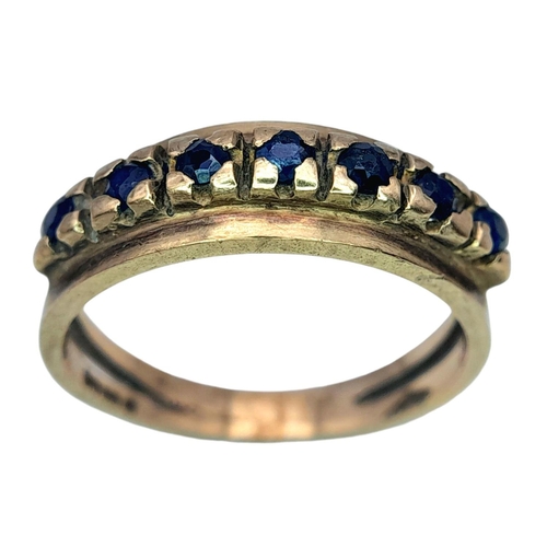 506 - A Vintage 9K Gold Seven Stone Sapphire Ring. Size N 1/2. 3.1g total weight.