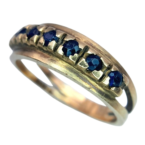 506 - A Vintage 9K Gold Seven Stone Sapphire Ring. Size N 1/2. 3.1g total weight.