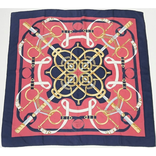 689 - A Hermes Silk Scarf with Four Sword Pattern. 90cm x 90cm. 
Ref: 019338.