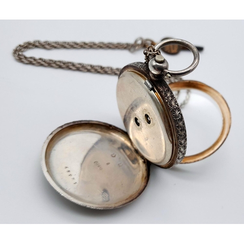 783 - An Antique 935 Silver Small Ladies Pocket Watch on a Sterling Silver Chain (with key). Engraved case... 