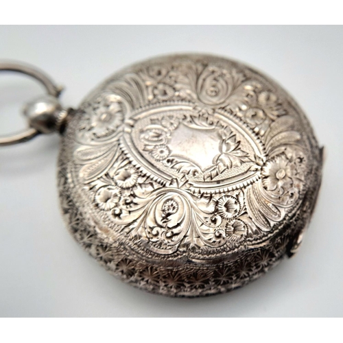 783 - An Antique 935 Silver Small Ladies Pocket Watch on a Sterling Silver Chain (with key). Engraved case... 