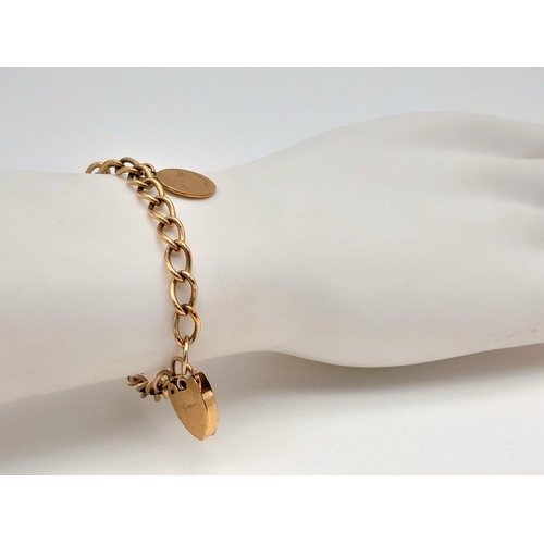 92 - A Vintage 9K Yellow Gold Bracelet with Heart Clasp. 18cm. 9.8g weight.