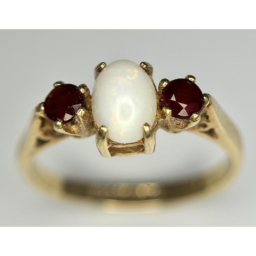 161 - Classic 9 carat GOLD, OPAL and GARNET RING. Having an OPAL CABOCHON set to centre with Round Cut GAR... 