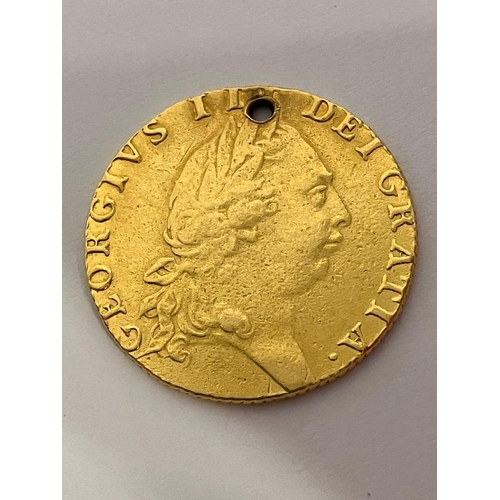 182 - 1791 GEORGE III GOLD GUINEA. Extra Fine condition. Drilled to top. 22 CARAT GOLD. 8.3 grams.