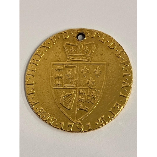 182 - 1791 GEORGE III GOLD GUINEA. Extra Fine condition. Drilled to top. 22 CARAT GOLD. 8.3 grams.