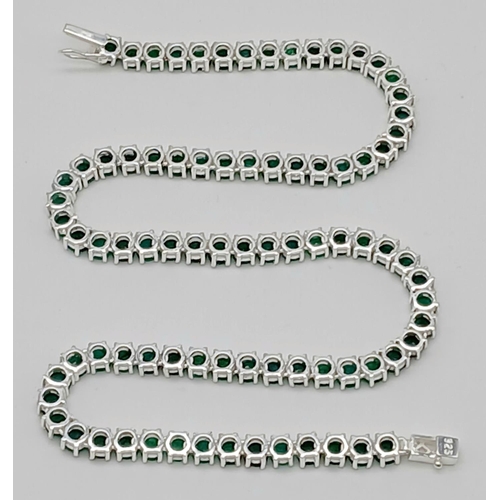 184 - An Emerald Gemstone Tennis Necklace. Set in 925 Silver. 44cm length. Ref: CD-1513