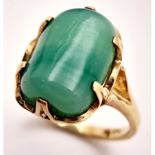 203 - Stunning 14 carat GOLD and JADE RING. Consisting a large polished JADE GEMSTONE set to top in attrac... 