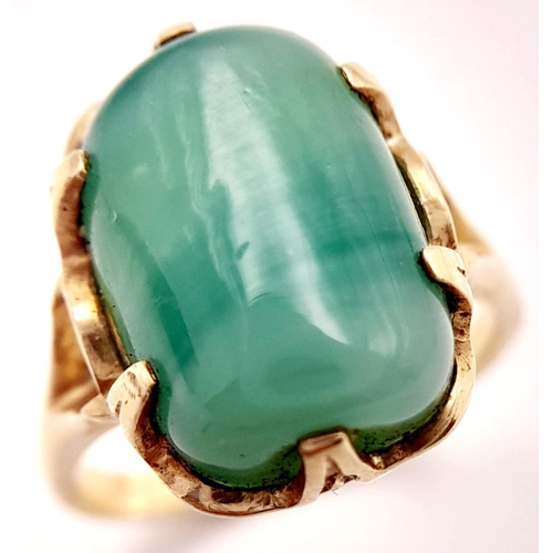 203 - Stunning 14 carat GOLD and JADE RING. Consisting a large polished JADE GEMSTONE set to top in attrac... 