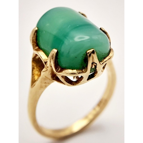 203 - Stunning 14 carat GOLD and JADE RING. Consisting a large polished JADE GEMSTONE set to top in attrac... 