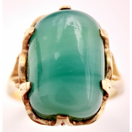 203 - Stunning 14 carat GOLD and JADE RING. Consisting a large polished JADE GEMSTONE set to top in attrac... 