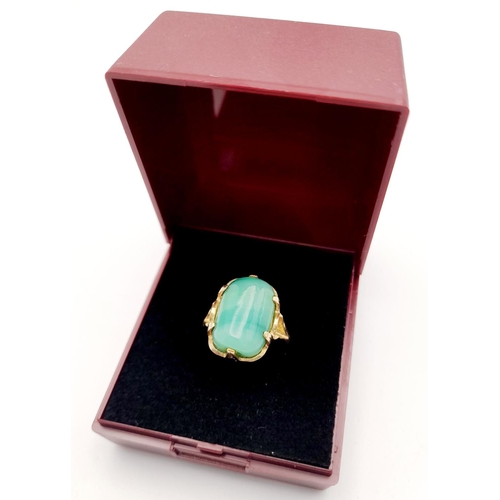 203 - Stunning 14 carat GOLD and JADE RING. Consisting a large polished JADE GEMSTONE set to top in attrac... 