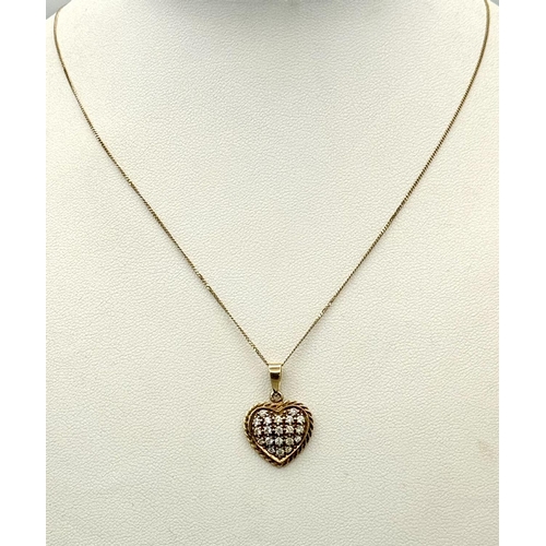 231 - Extremely Pretty 9 carat GOLD HEART PENDANT set with Crystals and mounted on a fine 9 carat GOLD CHA... 