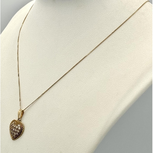 231 - Extremely Pretty 9 carat GOLD HEART PENDANT set with Crystals and mounted on a fine 9 carat GOLD CHA... 