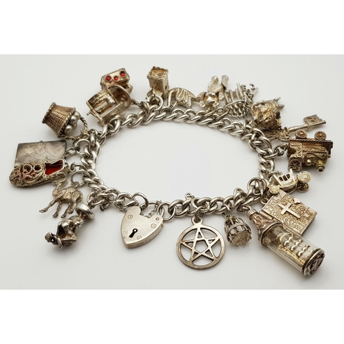 268 - A beautiful vintage Solid Silver 925 Charm Bracelet, with 19 charms, 80 grams, 18cm. In very good co... 